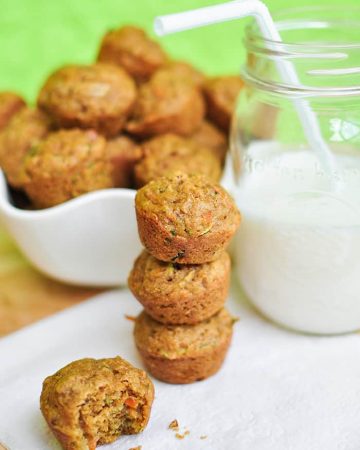 Mini Veggie Muffins -- loaded with carrots, zucchini, & whole wheat flour -- make a yummy, healthy breakfast or snack for toddlers, kids, and adults alike! | FiveHeartHome.com