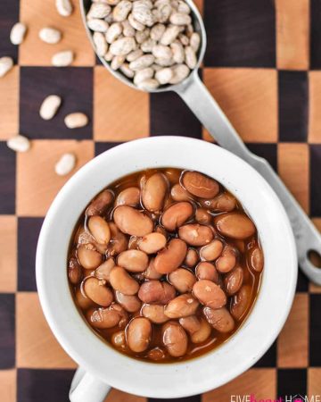 In a bowl with dried pintos on cutting board