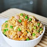 Easy Fried Rice in a white bowl in a wooden cutting board