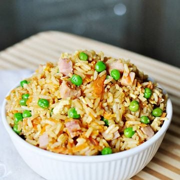 Easy Fried Rice in a white bowl in a wooden cutting board