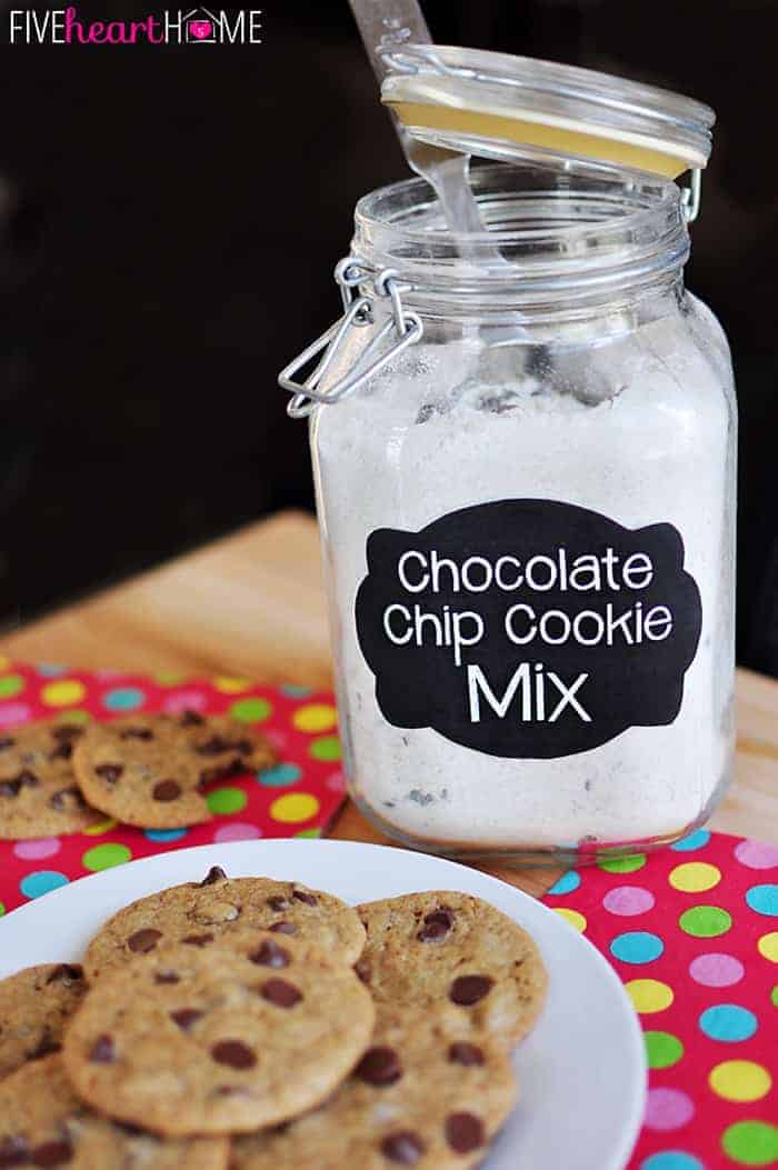 Jar of Chocolate Chip Cookie Mix with plate of fresh cookies.