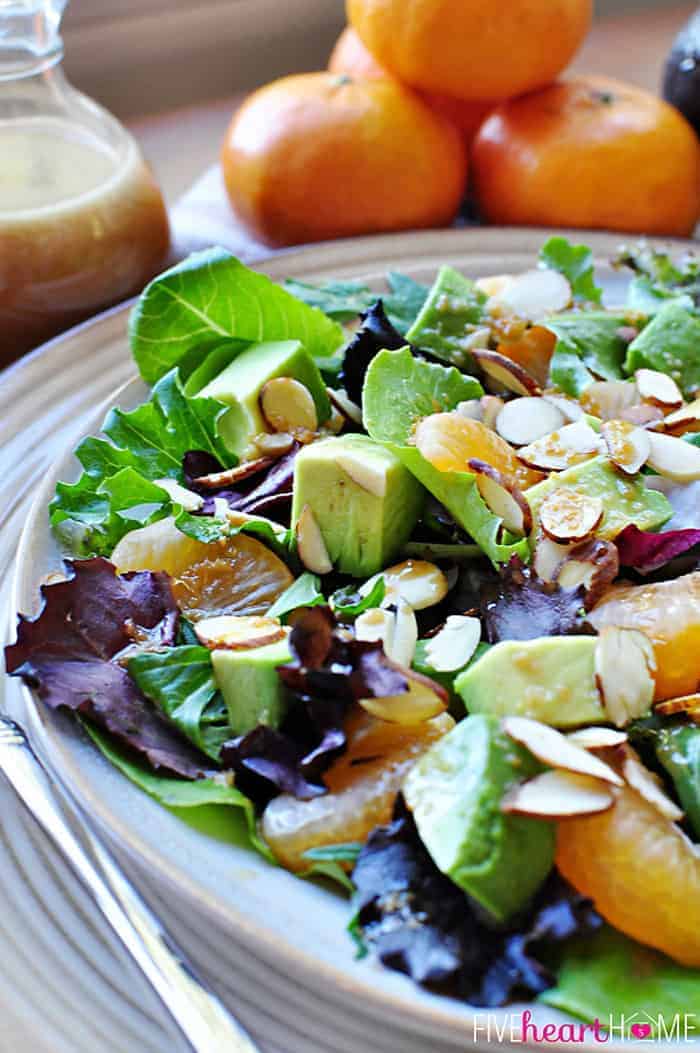 Mixed Greens Salad with Mandarins, Toasted Almonds, Avocado, and Sesame Ginger Vinaigrette.
