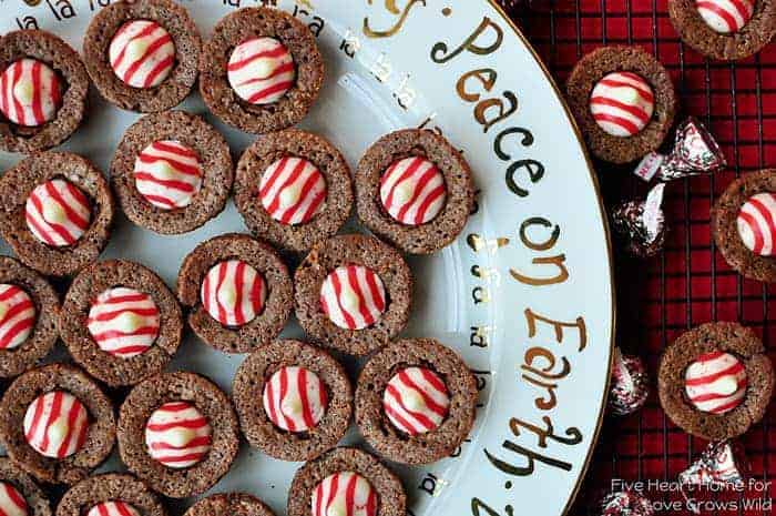 Aerial photo of a Christmas platter of brownie bites topped with red and white striped Hershey's Kisses