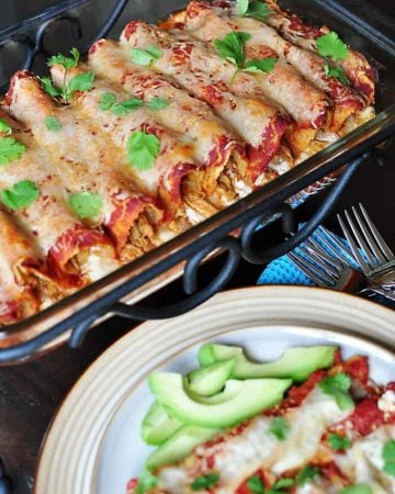 Creamy Chicken Enchiladas in baking dish and on plate.