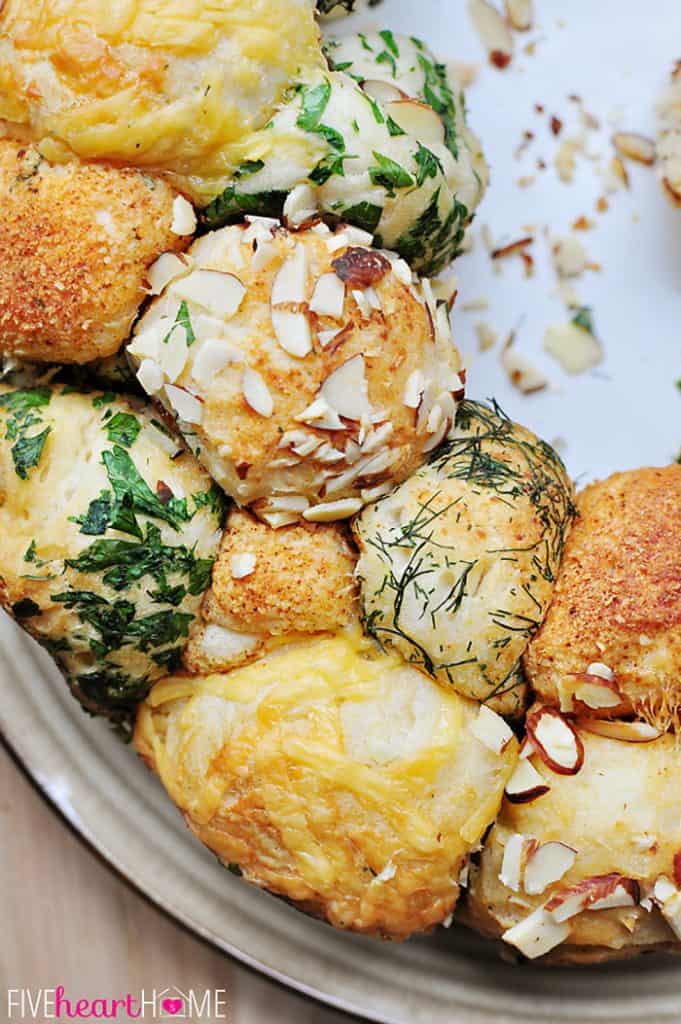 Close-up of Savory Monkey Bread coated with almonds, herbs, Parmesan, and cheddar