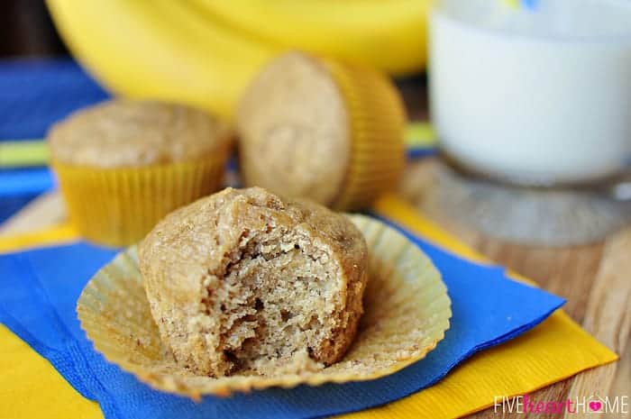 Healthy Banana Muffins ~ these muffins are delicious and wholesome, boasting healthy ingredients including whole wheat flour, coconut oil, yogurt, and honey! | FiveHeartHome.com Healthy Banana Muffins, one with missing bite.