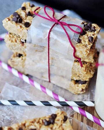 Stack of Chewy Granola Bars wrapped in wax paper and string.