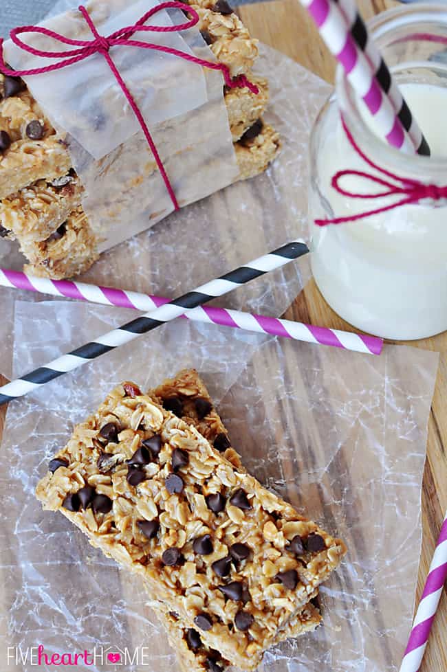 Aerial view of No-Bake Granola Bars with milk and striped straws.