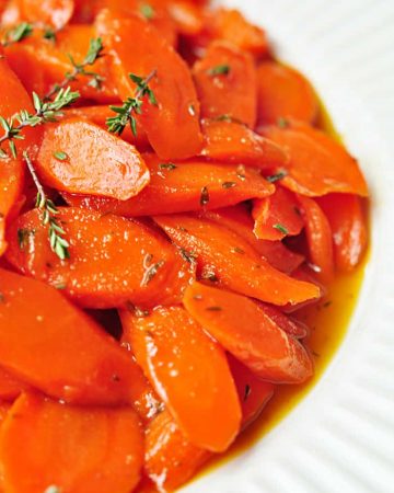 Honey-Glazed Carrots with Thyme and Lemon ~ a perfect spring side dish, and a gorgeous addition to your Easter menu! | FiveHeartHome.com