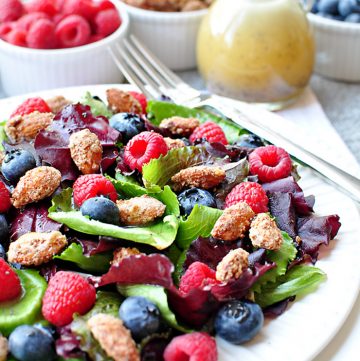 Spring Salad with Mixed Berries, Candied Almonds, and Honey Citrus Vinaigrette ~ a beautiful, delicious salad with vibrant flavors and varied textures | FiveHeartHome.com