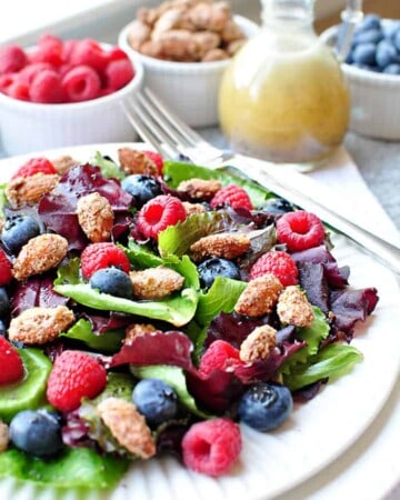 Spring Salad with Mixed Berries, Candied Almonds, and Honey Citrus Vinaigrette ~ a beautiful, delicious salad with vibrant flavors and varied textures | FiveHeartHome.com