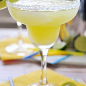 Fresh Pineapple Margaritas ~ made with fresh lime juice and pineapple purée, these are perfect for celebrating Cinco de Mayo or cooling off all summer long! | FiveHeartHome.com