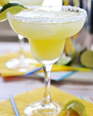 Fresh Pineapple Margaritas ~ made with fresh lime juice and pineapple purée, these are perfect for celebrating Cinco de Mayo or cooling off all summer long! | FiveHeartHome.com