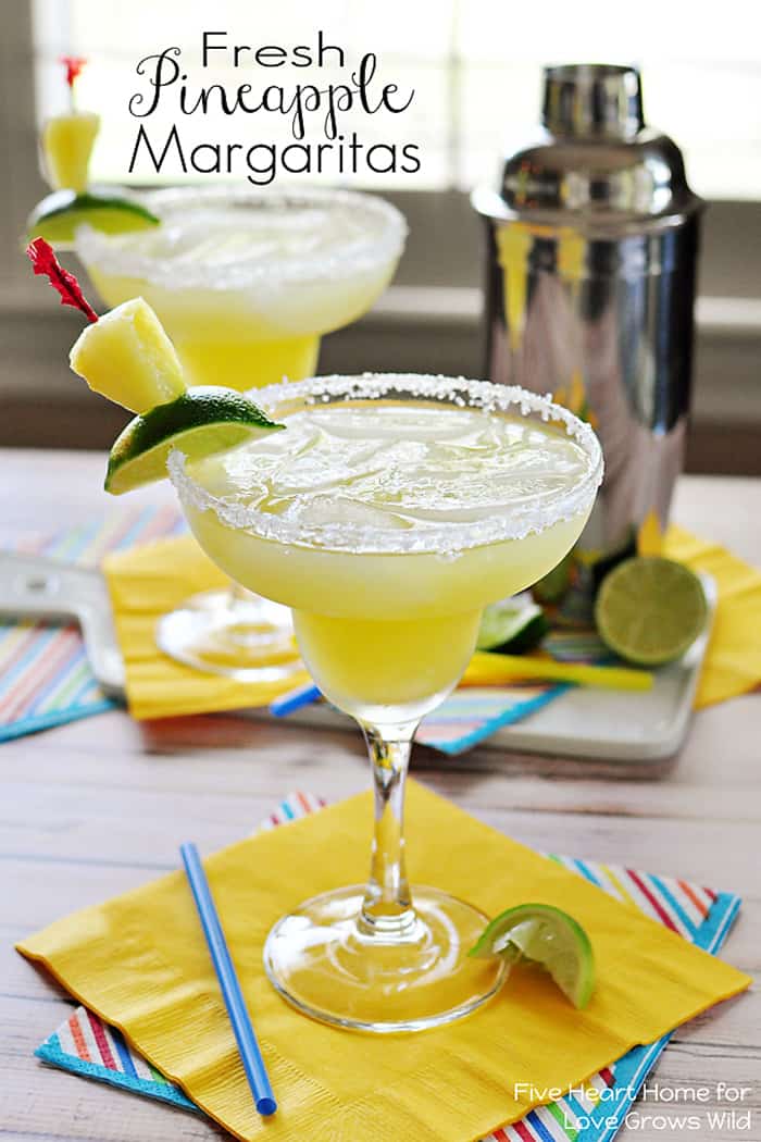 Fresh Pineapple Margaritas ~ made with fresh lime juice and pineapple purée, these are perfect for celebrating Cinco de Mayo | FiveHeartHome.com Fresh Pineapple Margaritas with text overlay.
