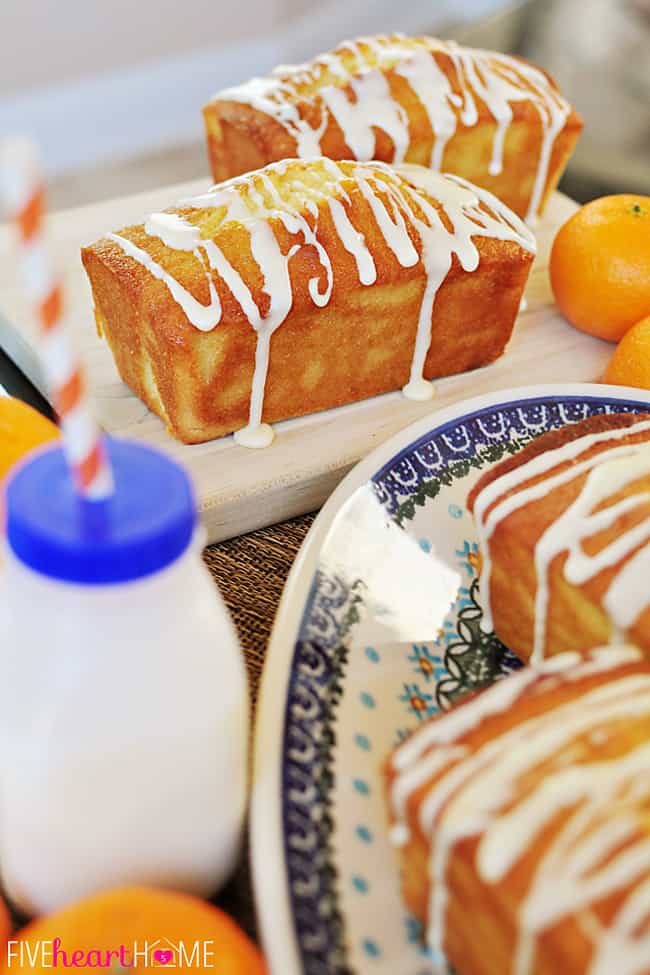 Orange Pound Cake loaves on serving platter and cutting board.