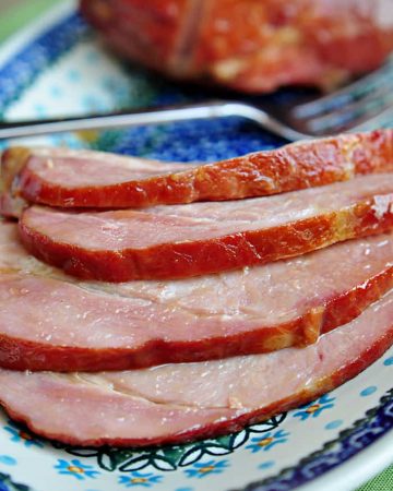 Slow Cooker Brown Sugar Ham sliced on a platter.