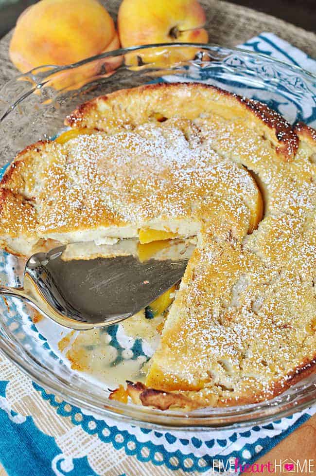 Peach German Pancake in baking dish with missing slice.