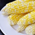 The Easiest, Tastiest, BEST Way to Cook Fresh Corn on the Cob: Oven Roasting! Simply wash & cook...once done, husks and silk peel away with no mess! | FiveHeartHome.com