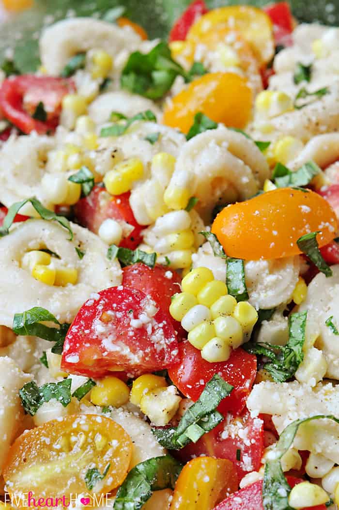 Close-Up of Tortellini Pasta Salad with Tomatoes, Basil, and Fresh Corn 