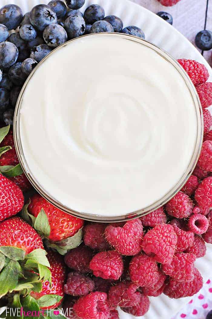 Aerial View of Dip Swirled in Glass Bowl Surrounded by Fresh Berries 