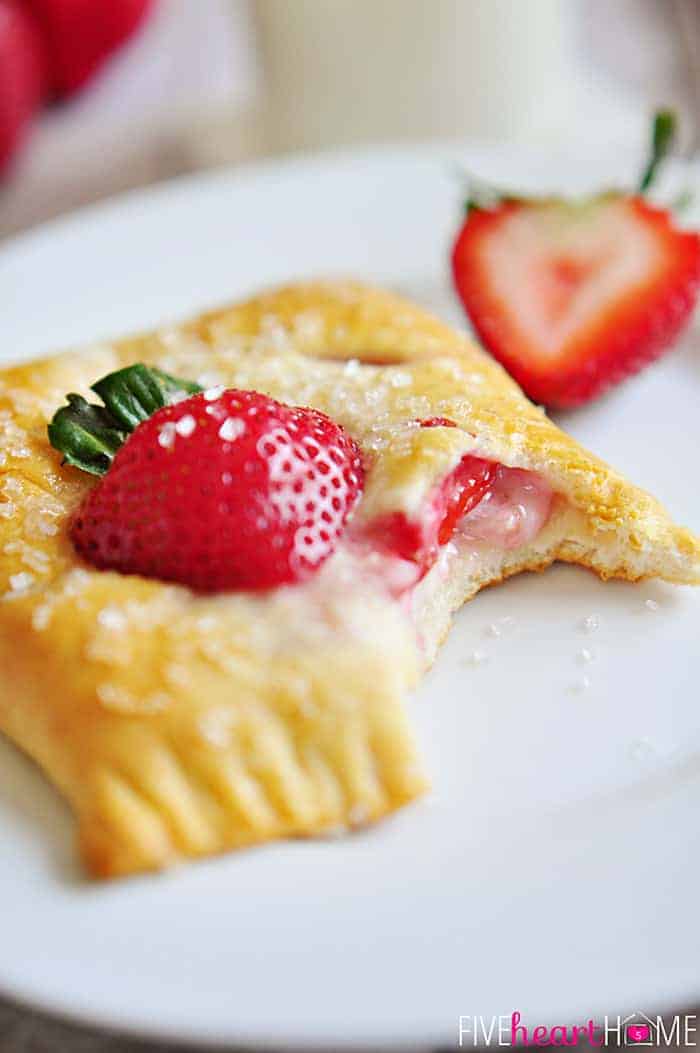 Strawberry Pastry on plate with missing bite.