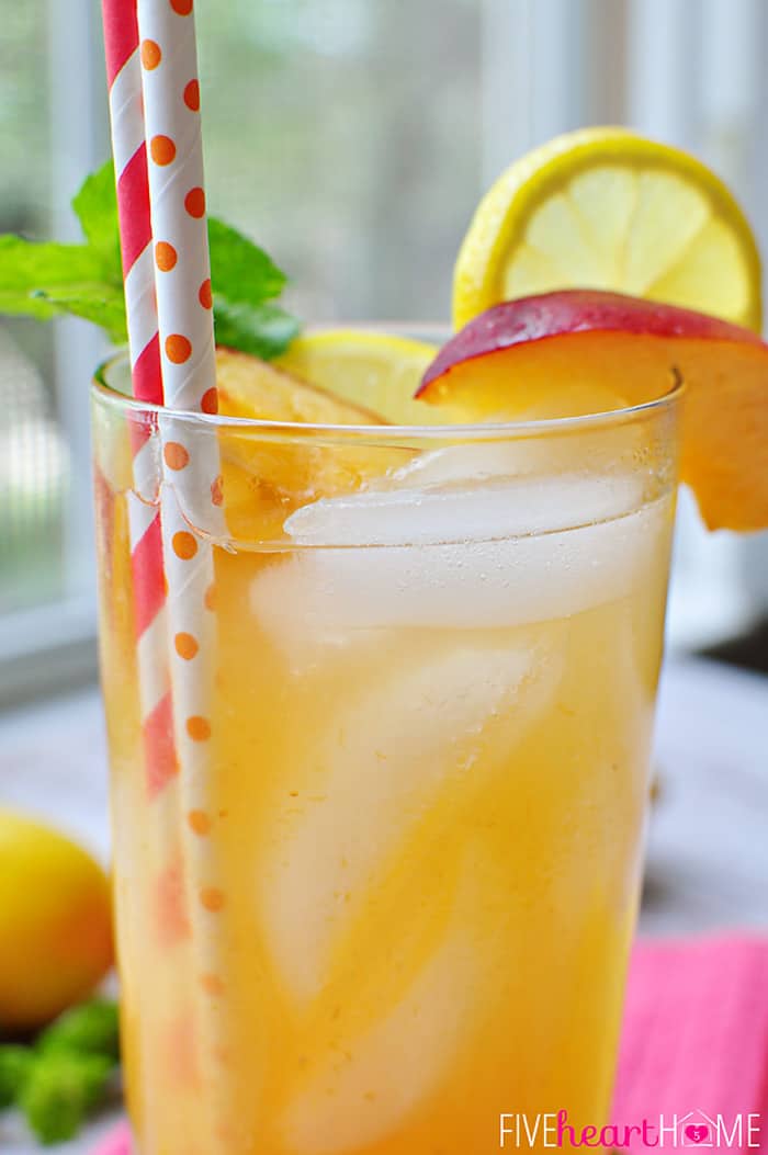Minty Peach Lemonade ~ homemade lemonade meets mint simple syrup and peach puree in this refreshing summertime drink | FiveHeartHome.com Close-Up of garnished glass