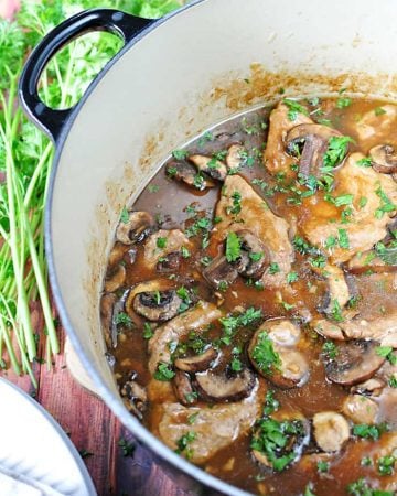 Aerial view of Pork Tenderloin with Mushroom Gravy in a large pot.