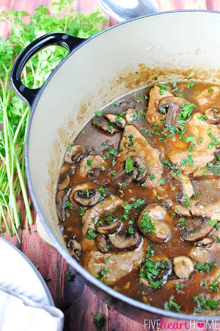 Aerial view of Pork Tenderloin with Mushroom Gravy in a large pot.