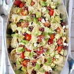 Aerial view of Tomato Cucumber Pasta Salad with Avocado in pewter serving bowl.