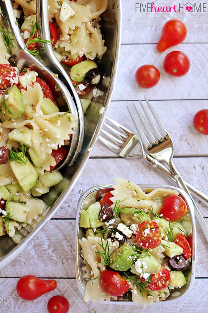 Aerial view of pasta salad in serving bowl and individual bowl.