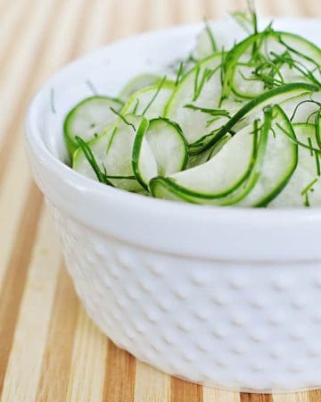 Tangy Cucumber Salad with Fresh Dill ~ thinly-sliced cucumbers in a simple, sweet-and-sour dressing make for a refreshing summer side | FiveHeartHome.com