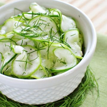 Tangy Cucumber Salad with Fresh Dill ~ thinly-sliced cucumbers in a simple, sweet-and-sour dressing make for a refreshing summer side | FiveHeartHome.com