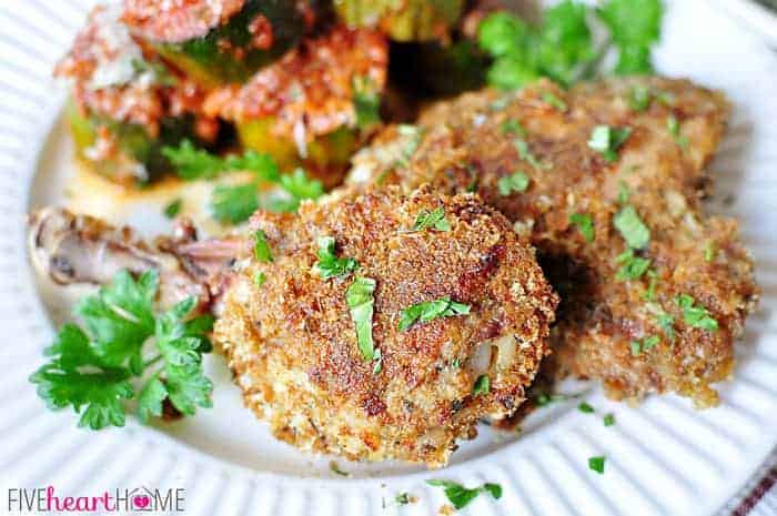 Baked Italian Chicken on a plate with zucchini.