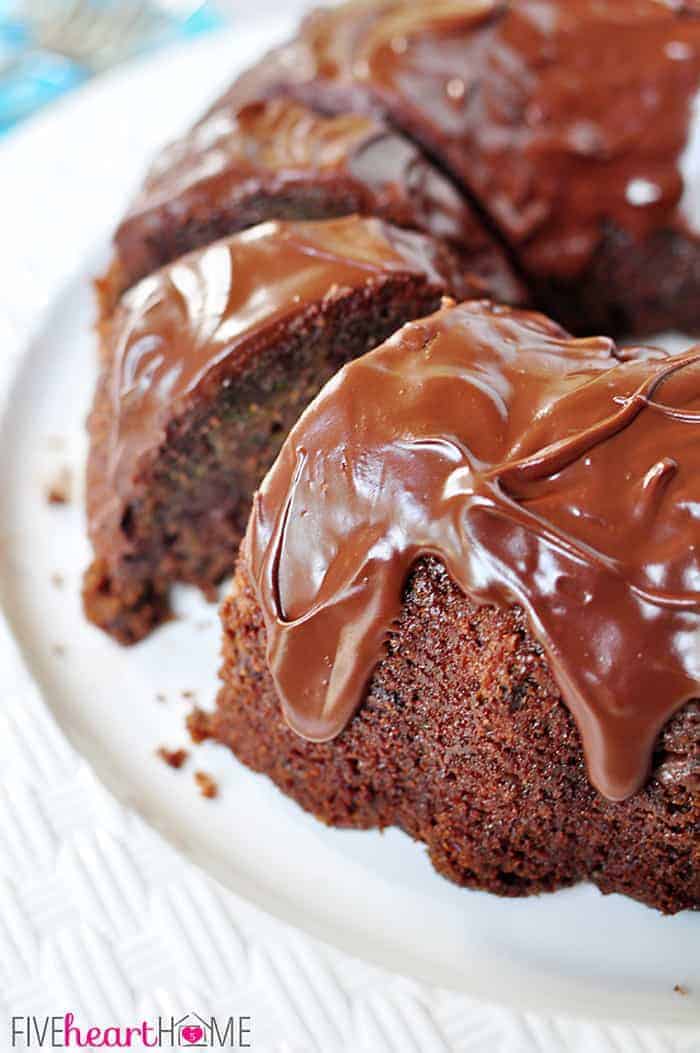 Close-up of sliced Chocolate Zucchini Bundt Cake on platter.