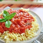 30-Minute Marinara Sauce with Fresh Tomatoes over plate of pasta.