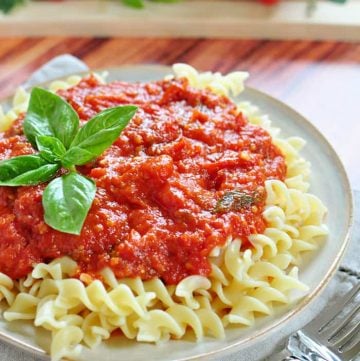 30-Minute Marinara Sauce with Fresh Tomatoes over plate of pasta.