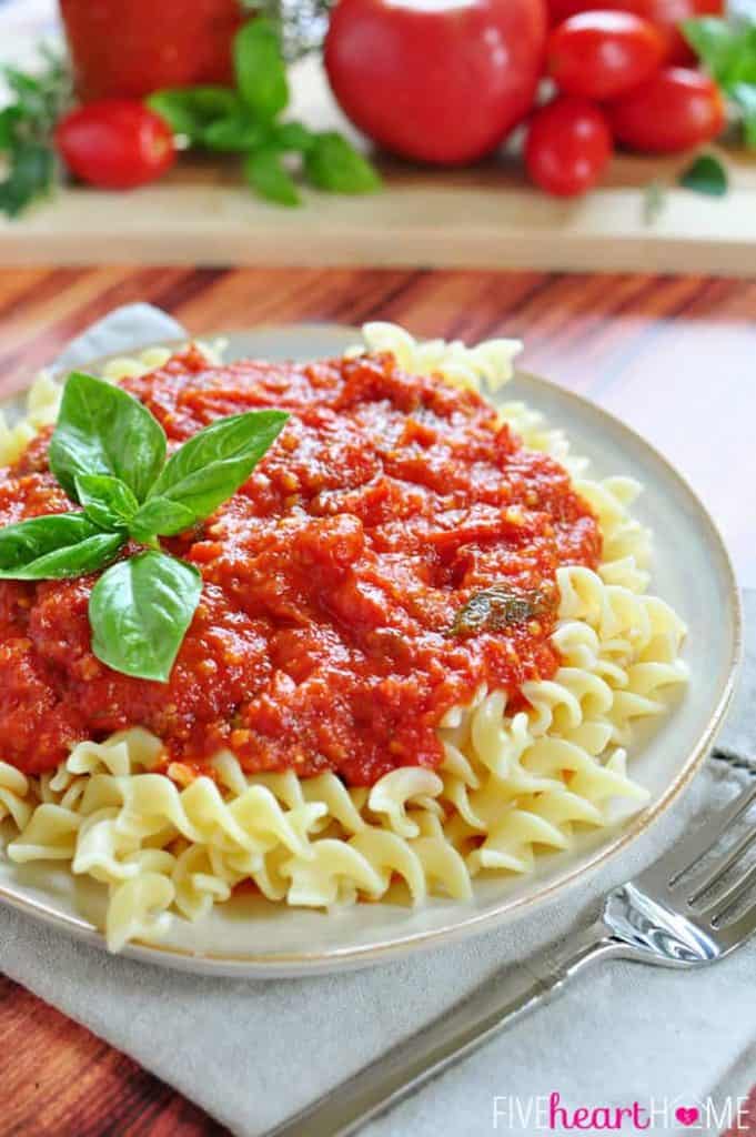 30-Minute Marinara Sauce with Fresh Tomatoes over plate of pasta.