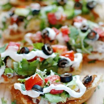 French Bread Taco Pizza sliced on cutting board