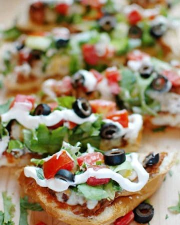 French Bread Taco Pizza sliced on cutting board