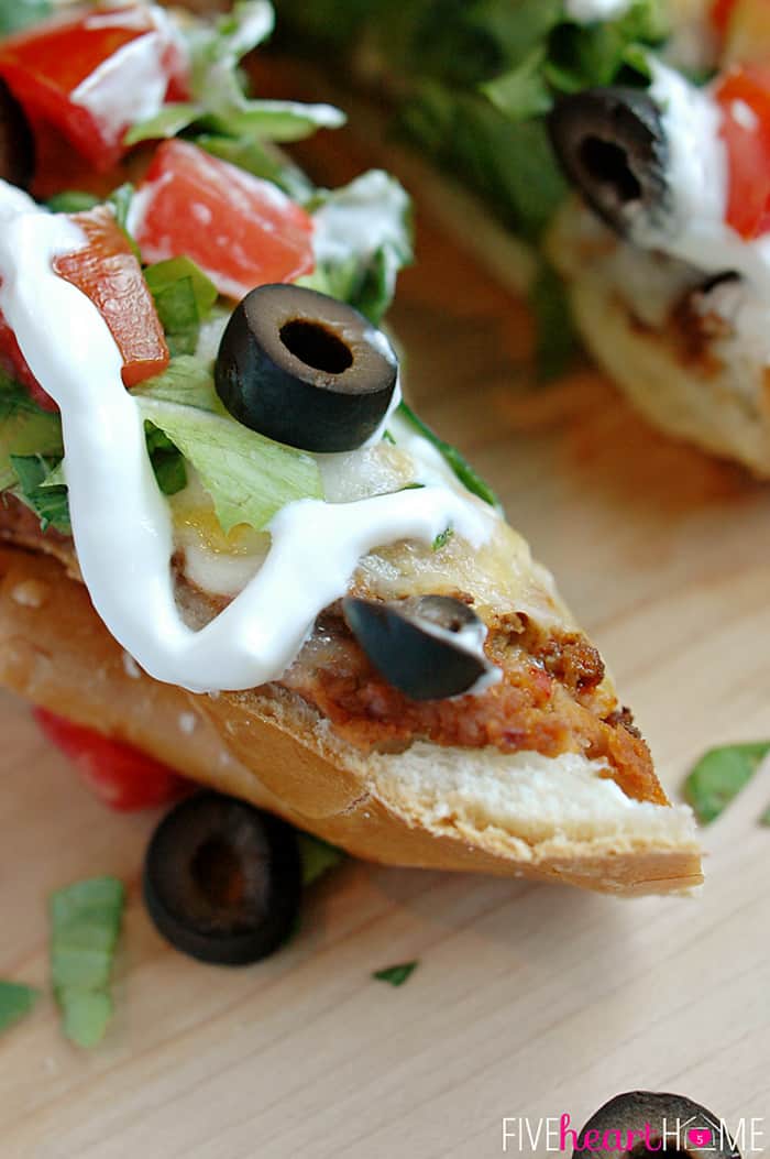 Close-Up of Lettuce, Tomatoes, Black Olives and Sour Cream 