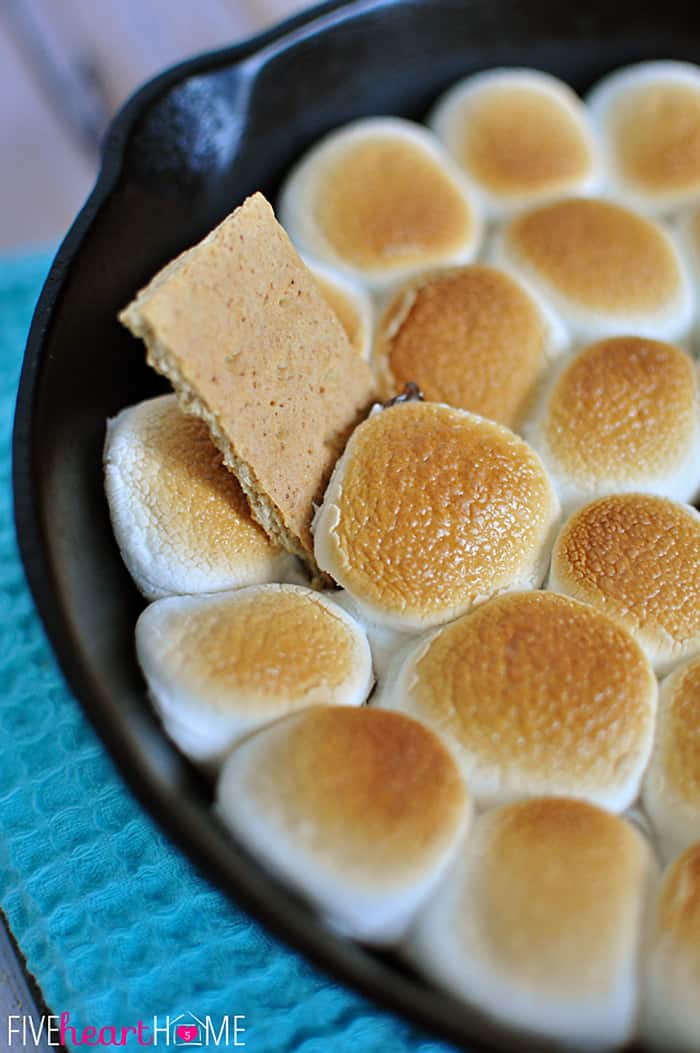 S'mores Dip recipe in skillet with graham cracker dipper.