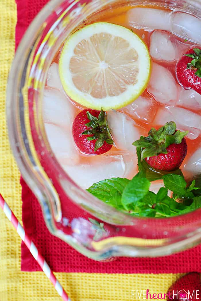 Aerial View of Pitcher with floating ice, and fresh fruit garnish 