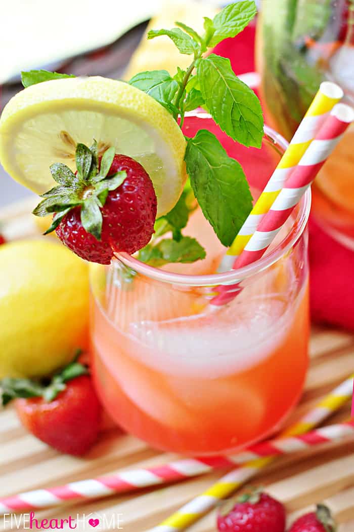 Aerial View Showcasing Fresh Strawberries, Mint and Lemon and Red striped Straw 