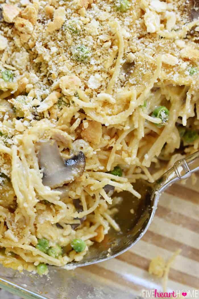 Close-up of pasta, mushrooms, peas, and crackers.