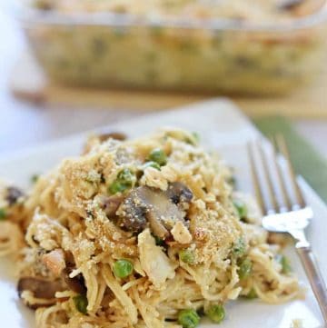 Cheesy Chicken Spaghetti on plate with fork.