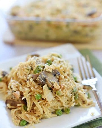 Cheesy Chicken Spaghetti on plate with fork.