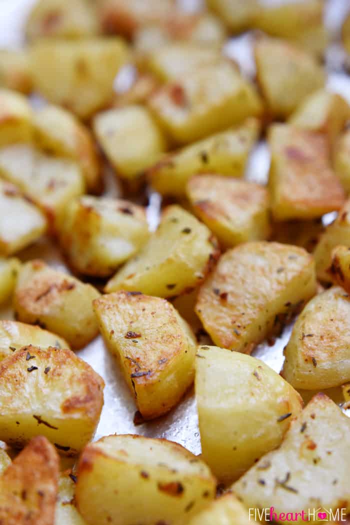 Garlic and Herb Roasted Potatoes ~ a simple, delicious side dish flavored with fresh rosemary and thyme | FiveHeartHome.com Close-Up of Garlic and Herb Roasted Potatoes Golden Brown and Fresh from the Oven