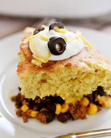 Mexican Beef and Cornbread Bake ~ taco-seasoned beef, black beans, and corn are topped with green chile cheddar cornbread in this quick, easy meal | FiveHeartHome.com