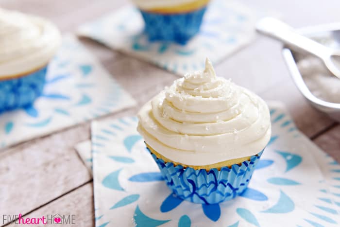  Homemade Vanilla Cupcakes on Decorative Blue Napkin 