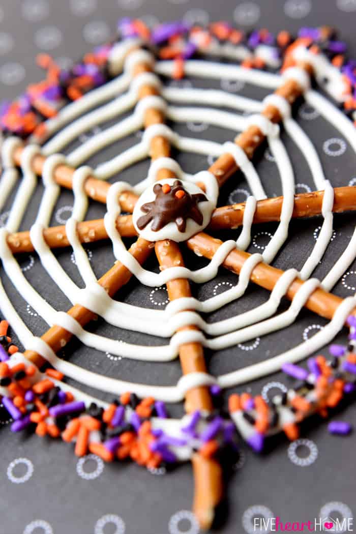 Spiderweb Halloween Pretzel Treat decorated with orange, black, and purple sprinkles